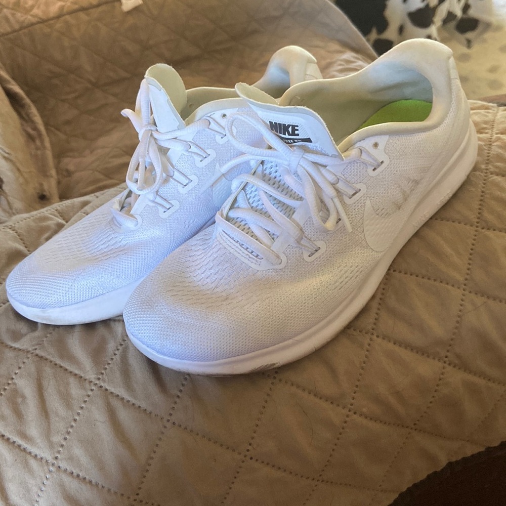 White Nike running shoes